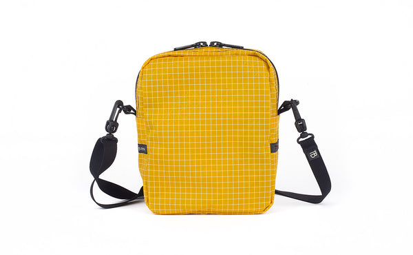A back view of the Everyday Cubelet in Solaris Halcyon (yellow with a white grid) showing a completely fabric back.